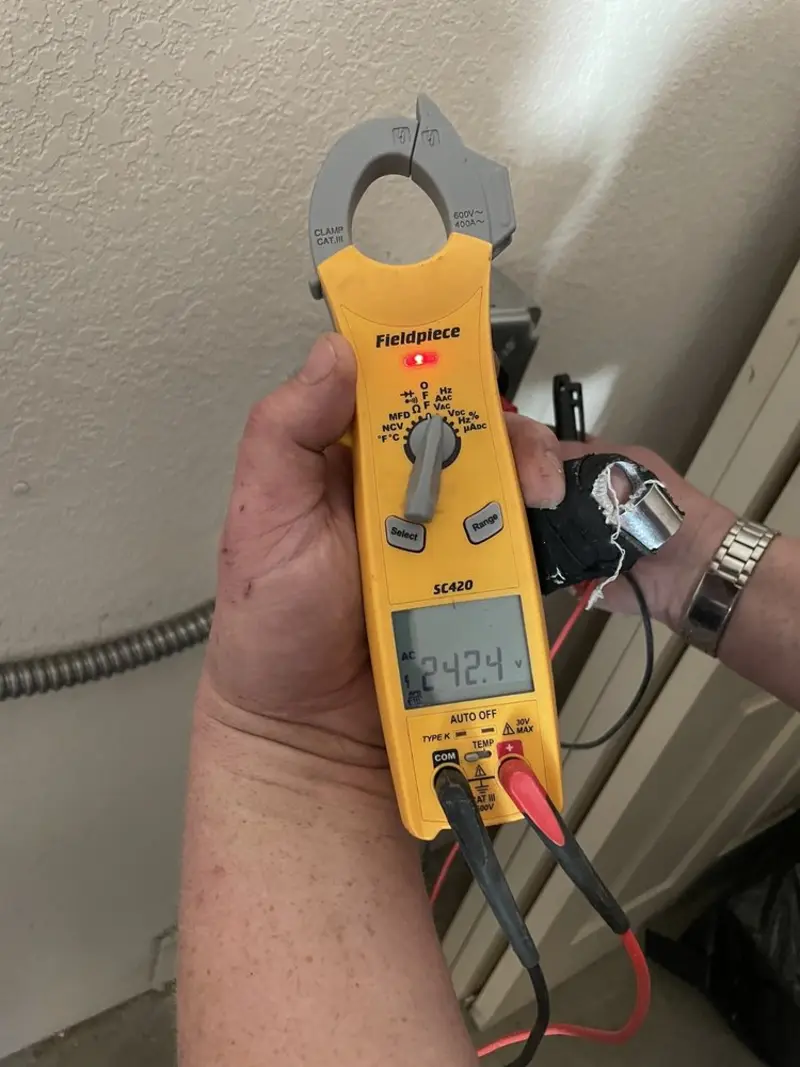 Voltage testing with clamp meter during Generator Installation in Massanetta Springs